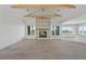 Unfinished living room featuring a fireplace, large windows, and exposed beam ceilings at 1286 Lisbon Dr, Parker, CO 80138