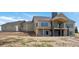 Rear view of a two story home showing the covered patio and ample windows at 1286 Lisbon Dr, Parker, CO 80138