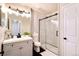 Stylish bathroom featuring a glass-enclosed shower and modern vanity with black hardware at 18397 E Alabama Pl # D, Aurora, CO 80017