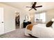 Comfortable bedroom with walk-in closet, ceiling fan, and natural light at 18397 E Alabama Pl # D, Aurora, CO 80017