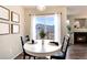 Lovely dining area featuring a round table, natural light, and views of the backyard at 18397 E Alabama Pl # D, Aurora, CO 80017