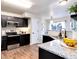Well-lit kitchen with stainless steel appliances, granite countertops, and a stylish sink area at 18397 E Alabama Pl # D, Aurora, CO 80017