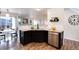 Charming kitchen features granite countertops, stainless steel dishwasher, and dark wood cabinets at 18397 E Alabama Pl # D, Aurora, CO 80017