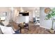 Open-concept living space with a modern kitchen, dining area, and comfortable seating at 18397 E Alabama Pl # D, Aurora, CO 80017