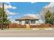 Inviting home exterior with a nice fence, green grass, and proximity to walking paths at 2441 E 47Th Ave, Denver, CO 80216