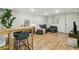 Finished basement living room with light wood floors and recessed lighting at 2441 E 47Th Ave, Denver, CO 80216