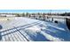 Snowy backyard with a fence and a glimpse of a pool at 15454 W Auburn Ave, Lakewood, CO 80228