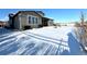 Spacious backyard with snow and a view of the house at 15454 W Auburn Ave, Lakewood, CO 80228