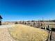 Spacious backyard with lush grass and a black metal fence, perfect for outdoor activities at 15454 W Auburn Ave, Lakewood, CO 80228