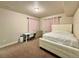 Basement bedroom with plush carpet and window coverings at 15454 W Auburn Ave, Lakewood, CO 80228