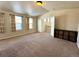 Bonus room features vaulted ceilings, a large closet, and neutral-toned walls and carpet at 15454 W Auburn Ave, Lakewood, CO 80228