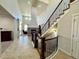 Open entryway showcasing a grand staircase and living room at 15454 W Auburn Ave, Lakewood, CO 80228