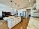 Modern kitchen with large island and granite countertops at 15454 W Auburn Ave, Lakewood, CO 80228