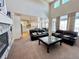 Spacious living room featuring high ceilings and a view to the kitchen at 15454 W Auburn Ave, Lakewood, CO 80228