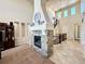 Living room with a stone fireplace and open floor plan at 15454 W Auburn Ave, Lakewood, CO 80228