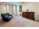 Cozy sitting area with a recliner and built-in cabinet at 15454 W Auburn Ave, Lakewood, CO 80228