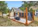 Charming backyard featuring a stone patio, outdoor dining set, privacy fence, and mountain views at 400 Argentine St, Georgetown, CO 80444