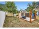 Quaint backyard featuring a stone patio, outdoor dining set, privacy screen, and mountain views at 400 Argentine St, Georgetown, CO 80444
