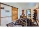 This dining room features hardwood floors, an open doorway, and a sliding barn door at 400 Argentine St, Georgetown, CO 80444