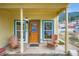 Inviting front porch with wood chairs and a decorative front door at 400 Argentine St, Georgetown, CO 80444