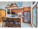 Bright kitchen with stainless steel appliances, brick backsplash, and island seating at 400 Argentine St, Georgetown, CO 80444