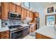 Modern kitchen featuring stainless steel appliances and wooden cabinets at 400 Argentine St, Georgetown, CO 80444