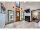 Bright living room with modern fireplace and wood-look flooring at 400 Argentine St, Georgetown, CO 80444
