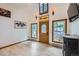 Bright living room with a fan, views of the front porch and hardwood floors at 400 Argentine St, Georgetown, CO 80444