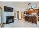 Open concept living room with an electric fireplace and views to the kitchen at 400 Argentine St, Georgetown, CO 80444
