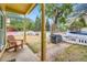 Relaxing front porch view with wood chair, grill and mountain views at 400 Argentine St, Georgetown, CO 80444