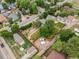 Aerial shot of the property showcasing the layout of the fenced backyard, mature trees and the surrounding neighborhood at 247 Tipple Pkwy, Frederick, CO 80530