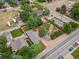 Expansive aerial view of home with large yard, mature trees, and detached garage on a sunny day at 247 Tipple Pkwy, Frederick, CO 80530