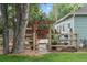 Scenic backyard with a wooden fence, arbor, and lush greenery, creating a peaceful retreat at 247 Tipple Pkwy, Frederick, CO 80530