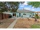 Beautiful backyard with a patio, lush greenery, a dining table, and stylish outdoor decor at 247 Tipple Pkwy, Frederick, CO 80530