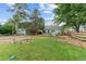 Large backyard with lush lawn, mature trees, and landscaping providing a great outdoor space at 247 Tipple Pkwy, Frederick, CO 80530