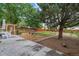 Expansive backyard featuring a patio area, mature trees, and a well-manicured lawn at 247 Tipple Pkwy, Frederick, CO 80530