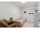 Inviting bedroom features a bright window, charming decor, and cozy textures; perfect for relaxation and restful nights at 247 Tipple Pkwy, Frederick, CO 80530