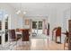 Bright dining area with modern lighting, stylish furniture, and ample natural light at 247 Tipple Pkwy, Frederick, CO 80530