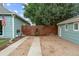 Long driveway leading to the house and garage with a fenced yard at 247 Tipple Pkwy, Frederick, CO 80530