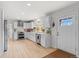 Spacious kitchen featuring white cabinets, stainless steel appliances, and a view to the outside at 247 Tipple Pkwy, Frederick, CO 80530