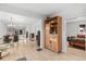 Open floor plan showing the dining and living areas with sleek flooring and modern decor at 247 Tipple Pkwy, Frederick, CO 80530