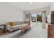 Cozy living room with a comfortable sofa, a large window, and stylish decor at 247 Tipple Pkwy, Frederick, CO 80530