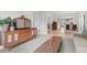 Cozy living room showcasing a vintage media center, hardwood floors, and a peek into the kitchen at 247 Tipple Pkwy, Frederick, CO 80530