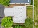 An aerial view of the home and lot including roof features, landscaping, and adjacent properties at 7725 Hummingbird Green # 78, Frederick, CO 80530