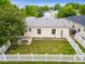 A fenced backyard with green lawn, patio, and view of the house's rear exterior at 7725 Hummingbird Green # 78, Frederick, CO 80530