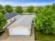 A home with a two car garage, adjacent landscaping, and mountain views in the distance at 7725 Hummingbird Green # 78, Frederick, CO 80530