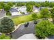 A view of the homes in the neighborhood, green space, and parking at 7725 Hummingbird Green # 78, Frederick, CO 80530