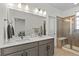 Double vanity bathroom with a walk-in shower at 1415 W 68Th Ave, Denver, CO 80221