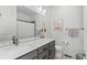 Modern bathroom with double vanity and a shower/tub combo at 1415 W 68Th Ave, Denver, CO 80221