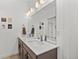 Elegant bathroom with double sinks and a large mirror at 1415 W 68Th Ave, Denver, CO 80221